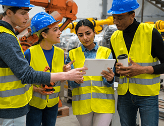 Employees looking at an ipad